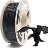 Spool of RepRapper Tech PLA black 1.75mm 1kg on speckled beige spool, neat glossy black windings and label visible, with a matching black 3D-printed eagle sample in the foreground on white studio background