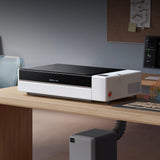 Bambu Lab R1 laser cutter set up on a desk in a home workshop