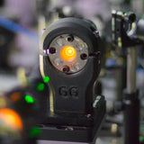 Black PA6-CF20 printed optics mount in a laser lab setup