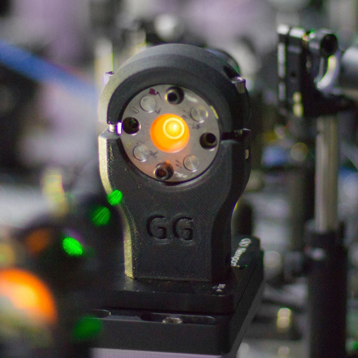 Black PA6-CF20 printed optics mount in a laser lab setup