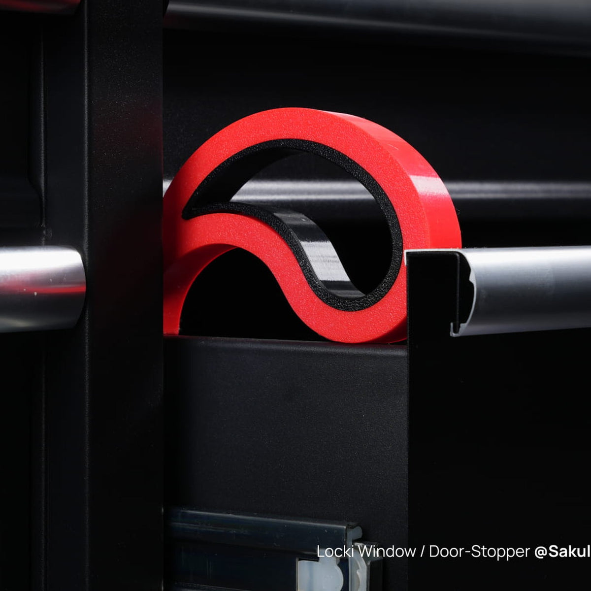 Flexible red and black door stopper printed in Bambu TPU for AMS