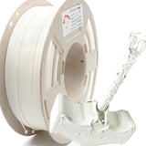 Spool of RepRapper Tech PLA white 1kg showing neat white windings and label beside a detailed white 3D-printed Mjolnir (Thor’s hammer) sample on white studio background