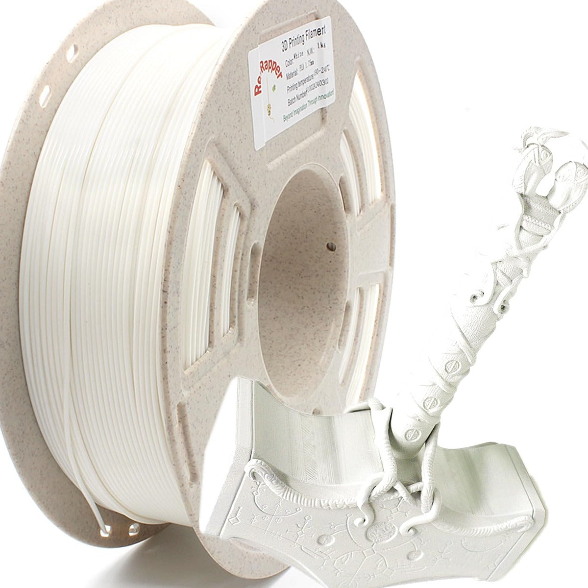Spool of RepRapper Tech PLA white 1kg showing neat white windings and label beside a detailed white 3D-printed Mjolnir (Thor’s hammer) sample on white studio background