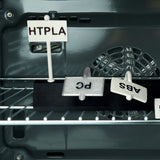 Oven rack heat test: HTPLA sign stays upright while PC, ABS, PETG signs sag