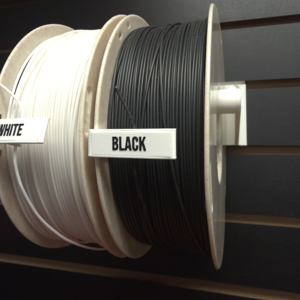 RepRapper Tech Fire Retardant PLA Black and White spools front view