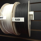 RepRapper Tech Fire Retardant PLA Black and White spools front view