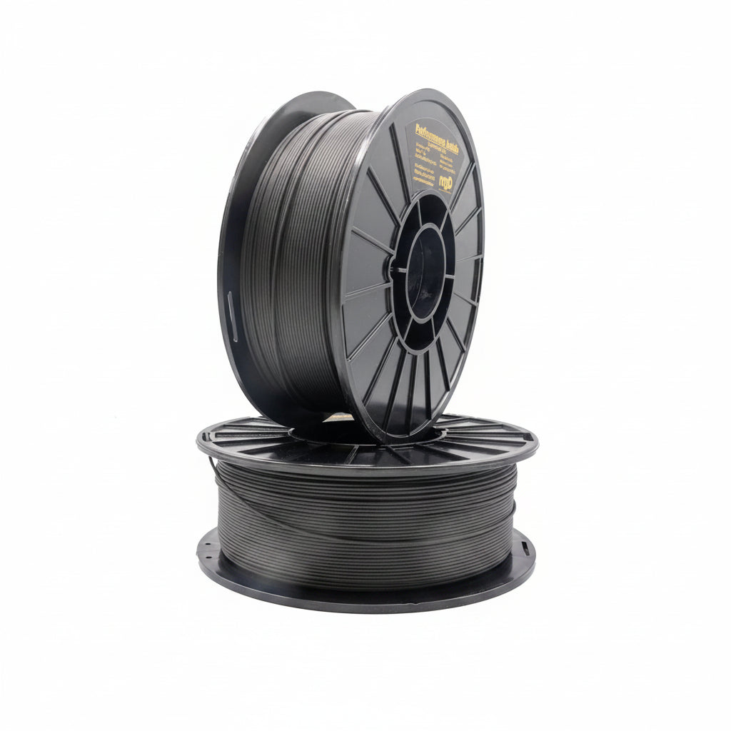 Two spools of black filament on a white background