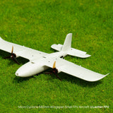 White FPV model plane 3D printed in Bambu PLA Tough+ sitting on grass