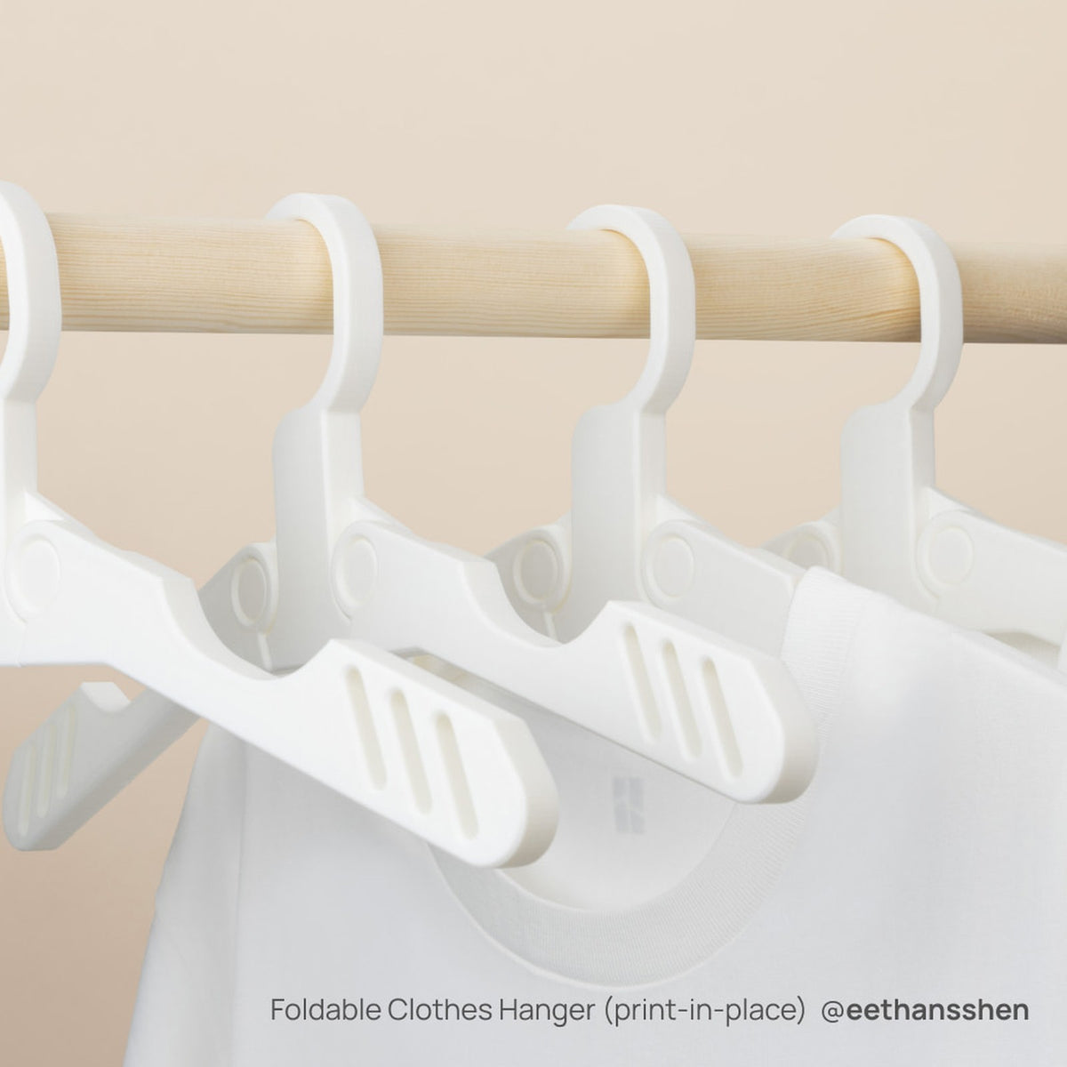 Folding clothes hangers printed in place in white Bambu PLA Tough+