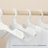 Folding clothes hangers printed in place in white Bambu PLA Tough+