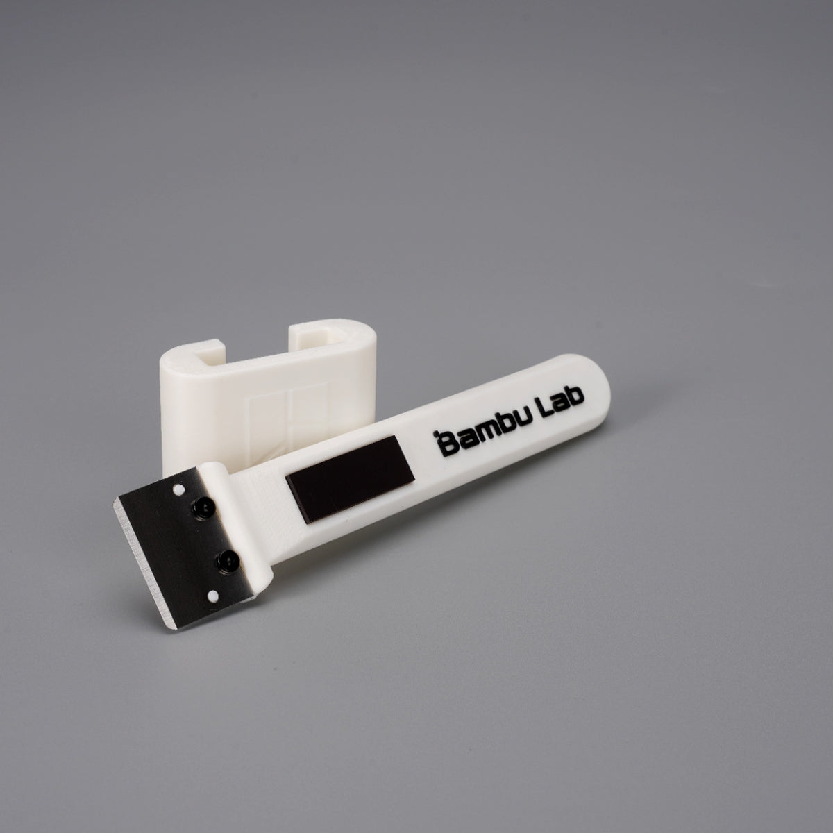 Bambu scraper blade fitted in the free printed Bambu Lab grip